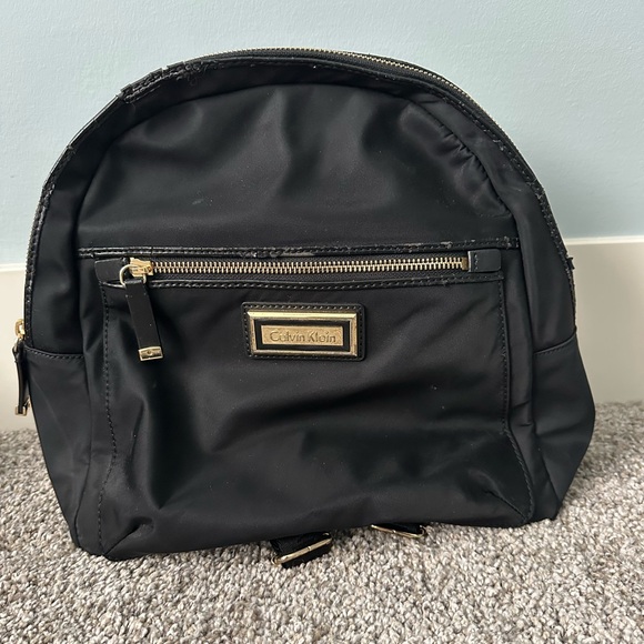 calvin klein backpack mini Women's Elaine Signature Key Item Flap Backpack, Brown/Khaki/Luggage Saffiano, One Size : Clothing, Shoes & Jewelry this backpack by Calvin Klein elevates hands Calvin Klein Garnet Triple Compartment